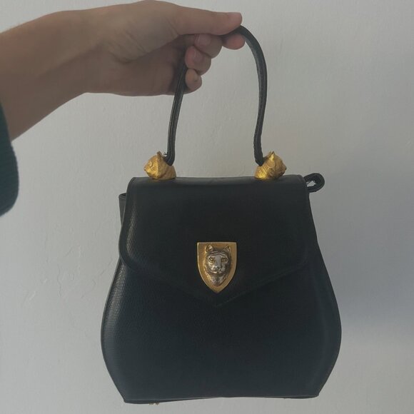 Handbags - Vintage Black Leather Shoulder Bag with Gold Cat Accent Detail